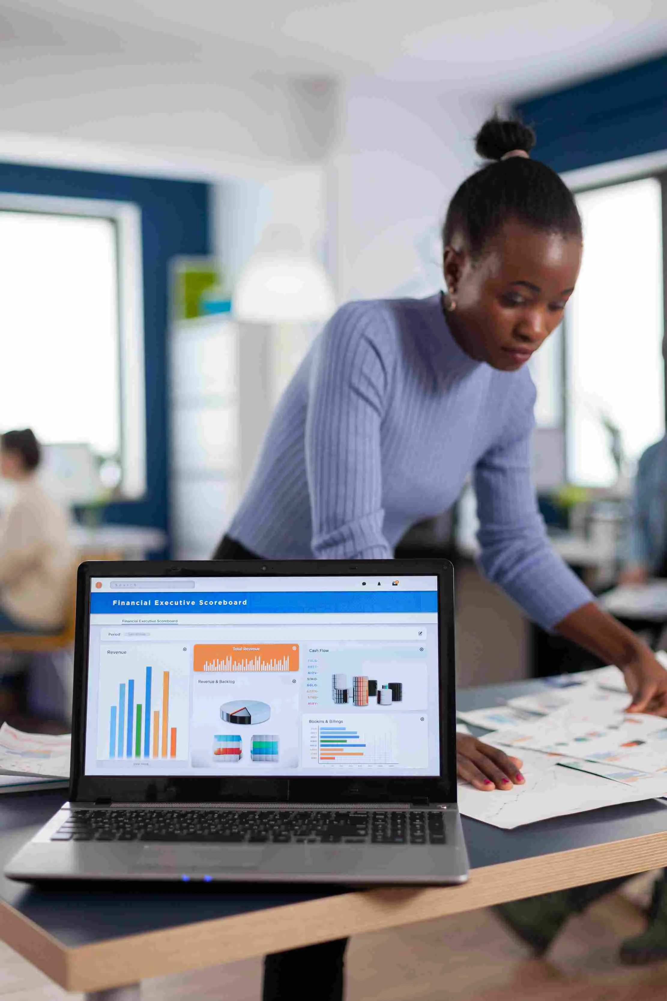 Business owner reading financial charts and statistics on a laptop, representing Maduuka's profit and loss reporting