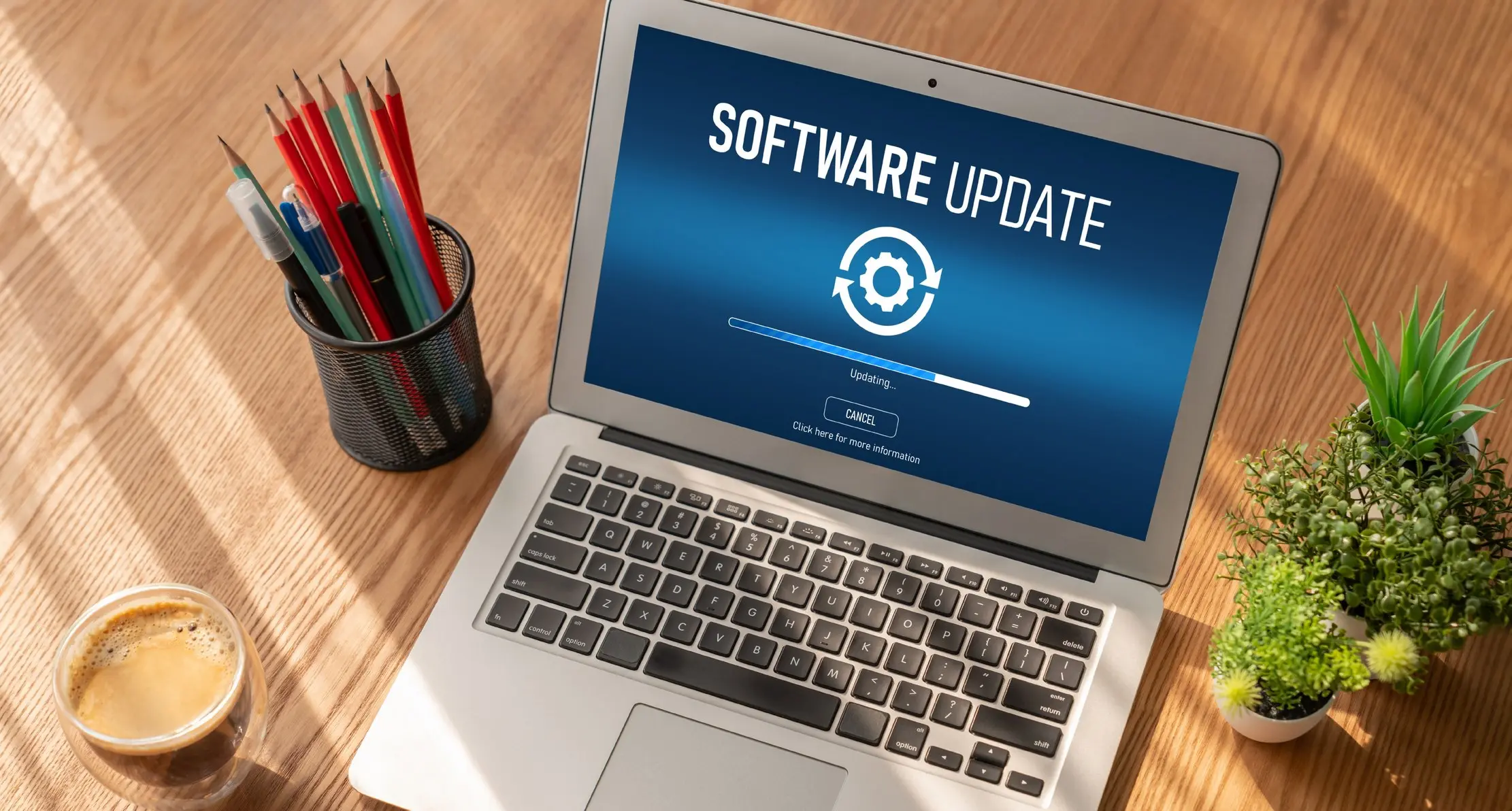 Laptop screen showing a software update, used to illustrate a connected record synchronising
