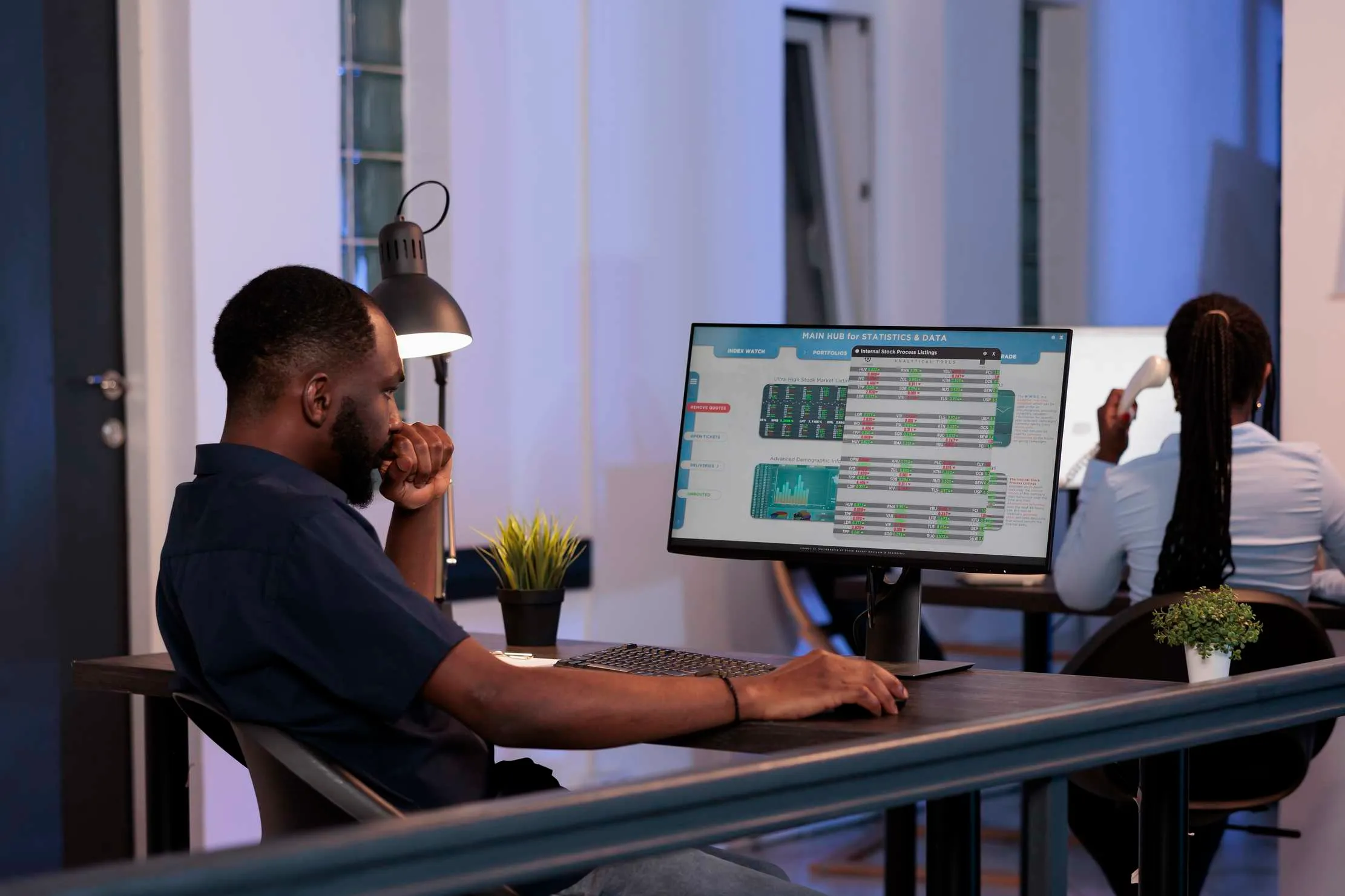 Manager analyzing financial reports and market statistics, representing data-driven decisions with Maduuka