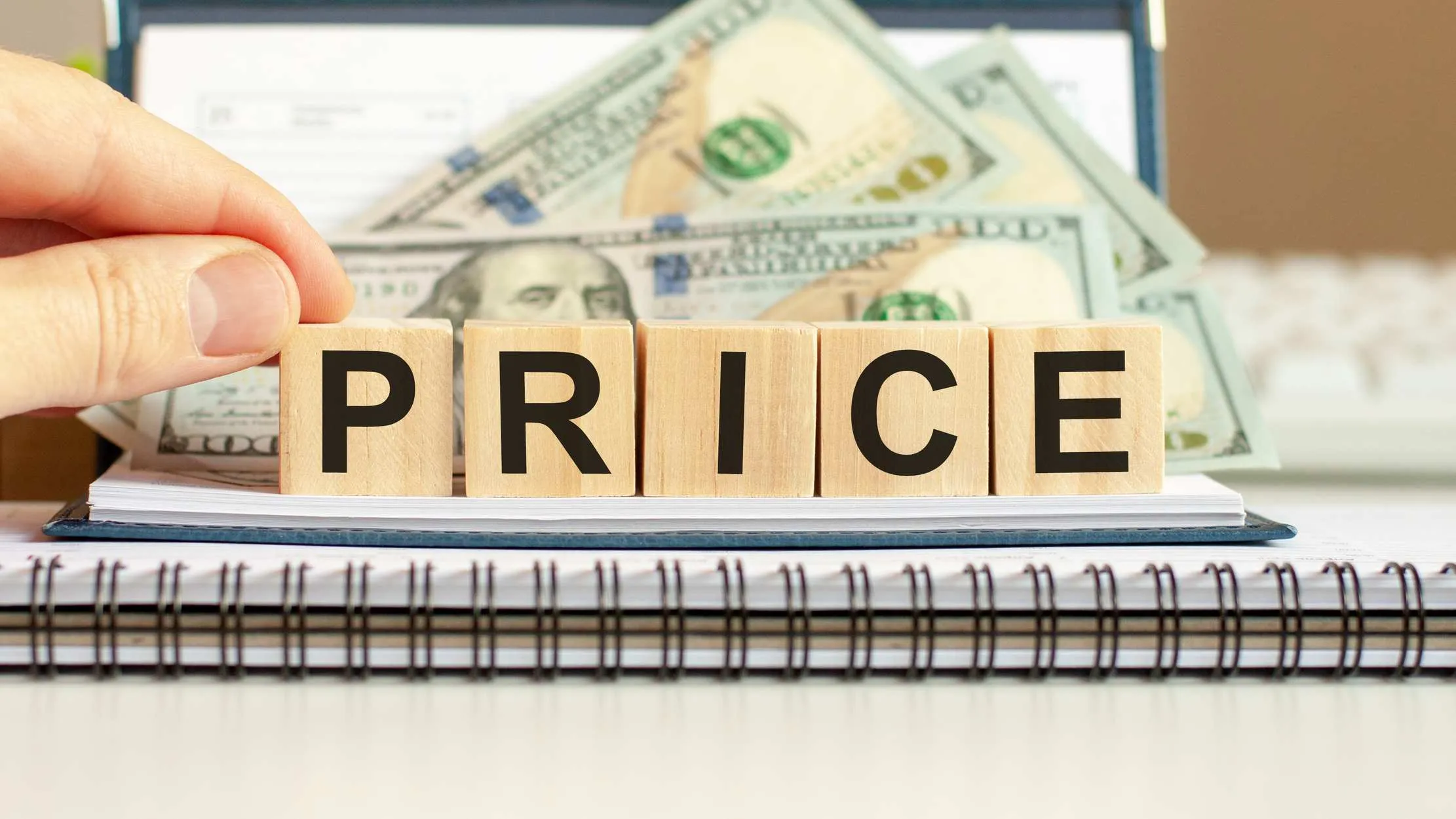 Wooden price blocks representing the pricing decisions managers control in Maduuka